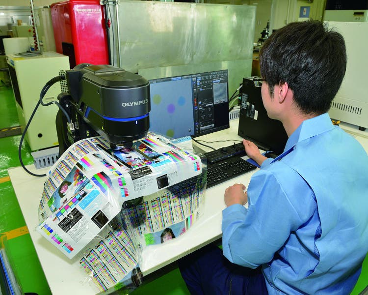 Takashi Yoshioka analyzing a printing sample using the DSX1000 microscope, the first step in the Think Laboratory’s quality control process