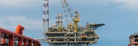 View of an offshore oil production platform from a tugboat