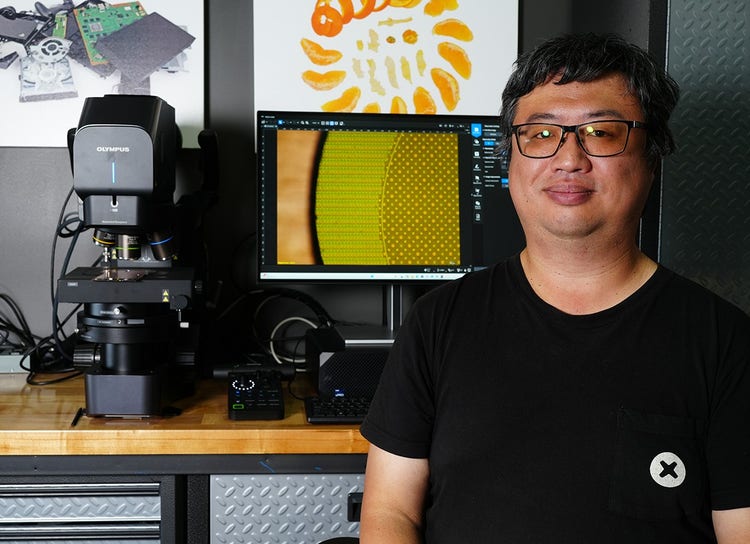Arthur Shi at the DSX2000 digital microscope in iFixit’s teardown lab