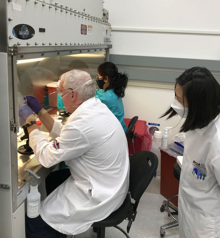 Bob McLean helps with spaceflight inoculation at KSC.