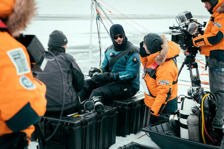 Will Smith prepares to dive under the ice with Dr. Allison Fong to collect samples in the waters of the North Pole.