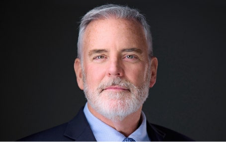 A person with a beard and mustache AI-generated content may be incorrect.