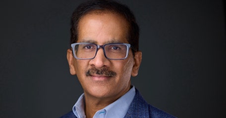 A person with a mustache wearing glasses AI-generated content may be incorrect.