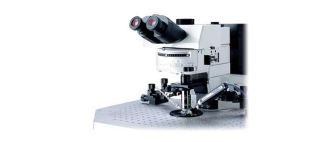 A microscope with several lenses AI-generated content may be incorrect.