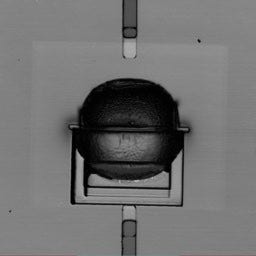 Figure 2. (a) A laser-scanning image shows the damaged cavity caused by the FIB. (b) An undamaged cavity. The OLS5000 microscope is nondestructive; cavities can be imaged at any point during the process flow of the device.