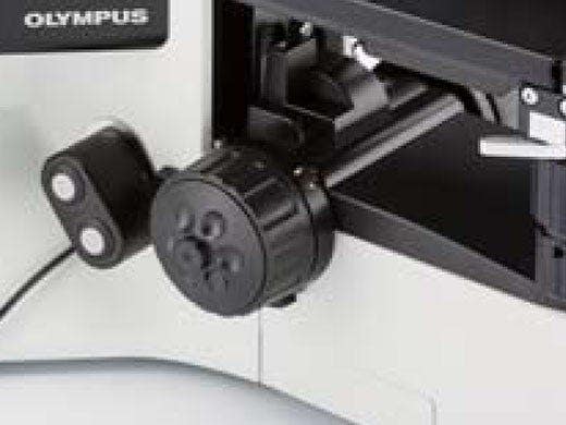 Hand switch for motorized nosepiece rotation